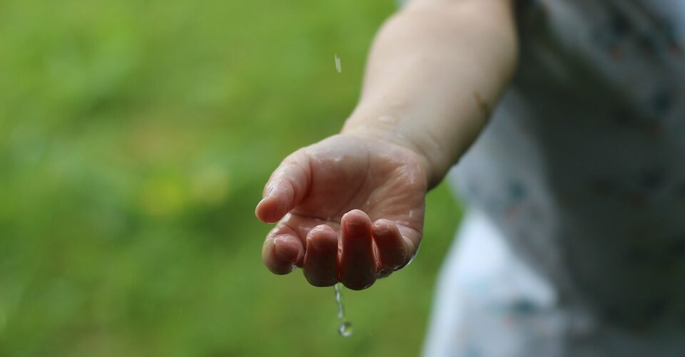 Rain drops on hand.