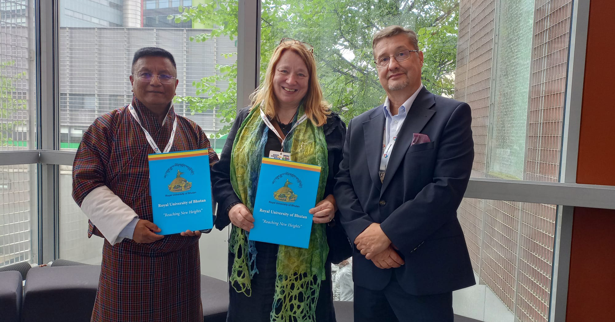Dr Som Gurung from the Royal University of Bhutan, professor Maija Aksela from the University of Helsinki and chair of the board of LUMA Center Finland Jan Lundell, sign Memorandum of Understanding.
